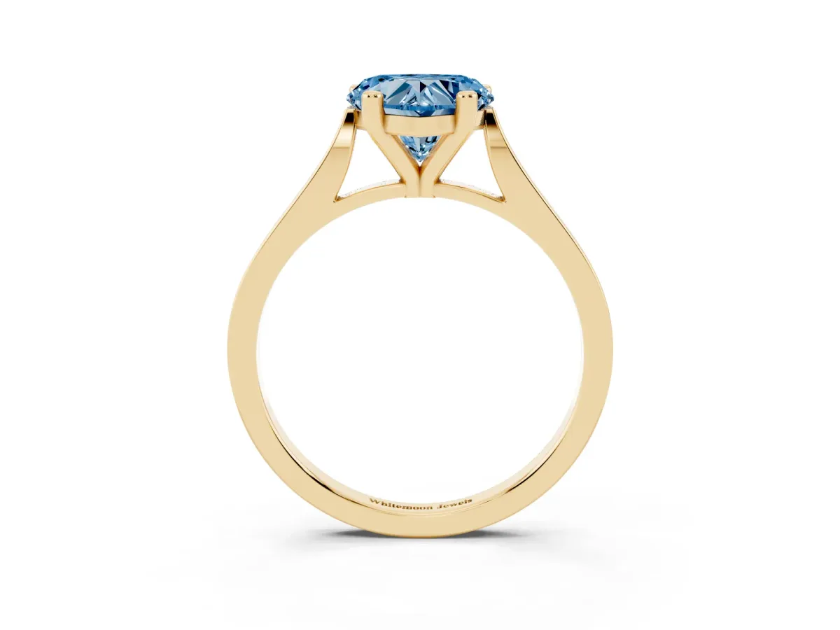 Fancy Blue Heart Cut Solitaire Diamond Ring with Four-Prong Setting and Tapered Band Yellow gold