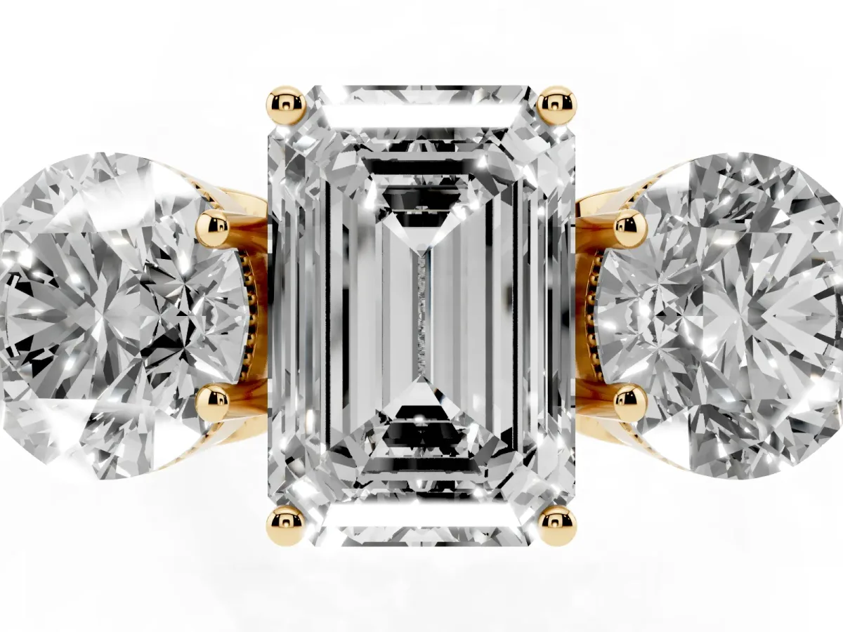 Three-Stone Emerald Cut Diamond Engagement Ring with Prong Setting on a Classic Band Yellow gold