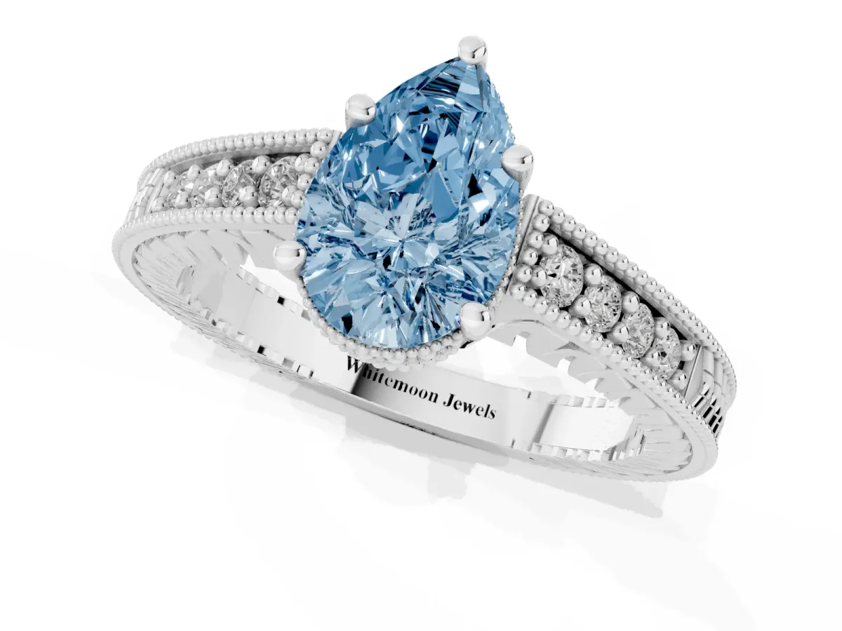 Fancy Blue Pear Cut Solitaire Pavé Diamond Milgrain Engagement Ring with Four-Prong Setting Silver