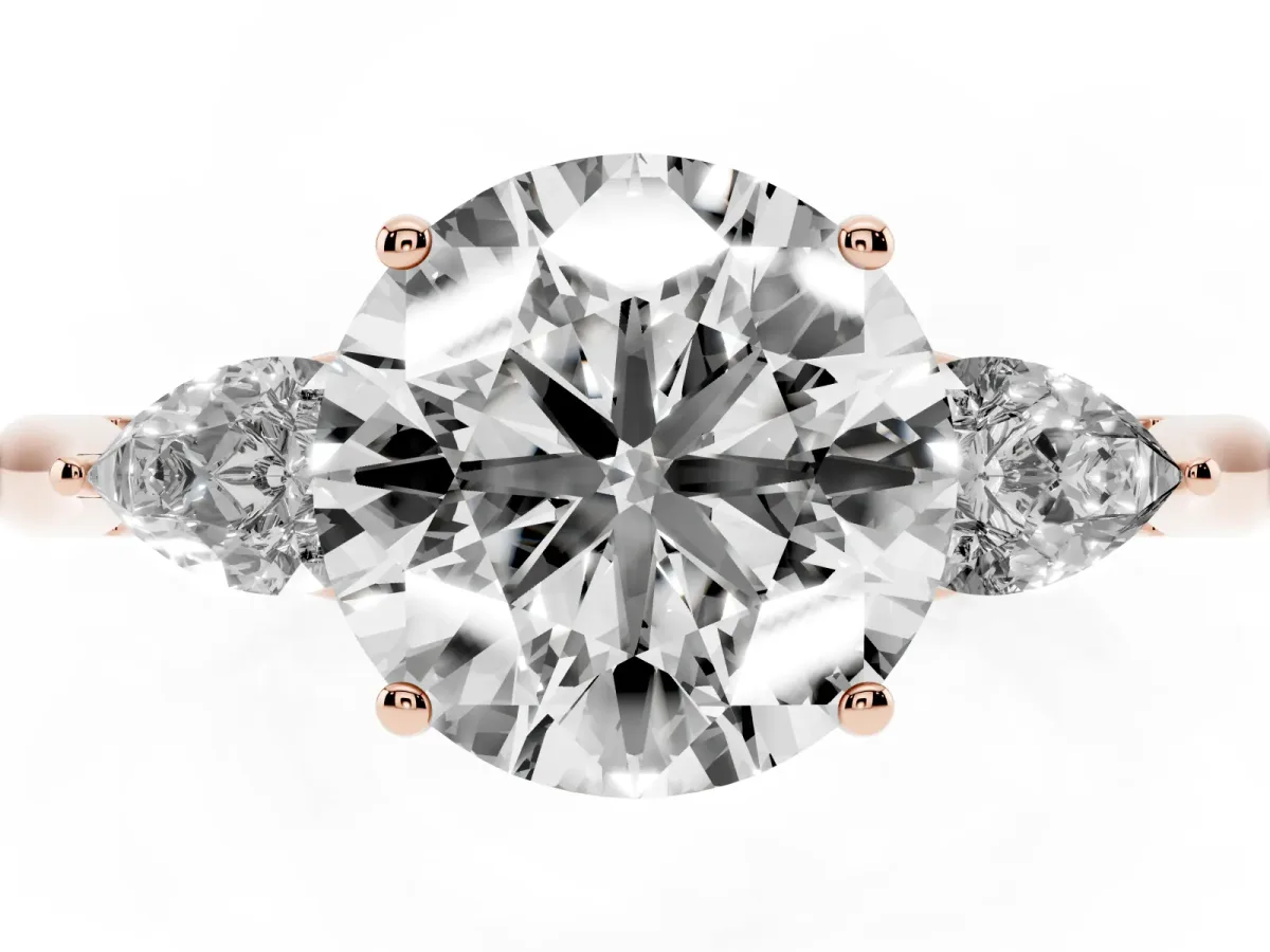 Round Cut Diamond Three-Stone Ring with Pear Side Stones and Prong Setting Rose gold