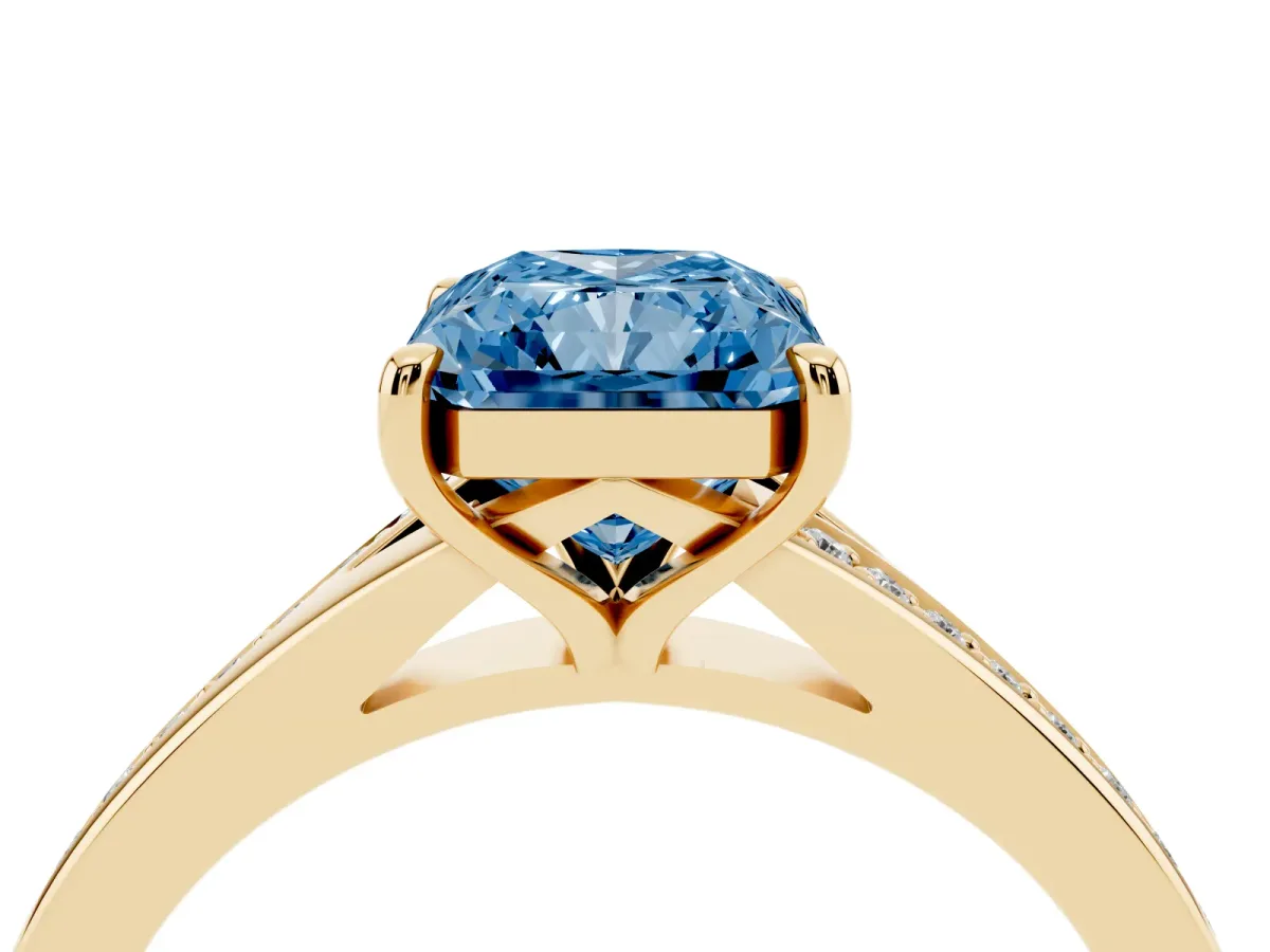 Fancy Blue Radiant Cut Diamond Solitaire Ring with Pavé Band and Prong Setting Yellow gold