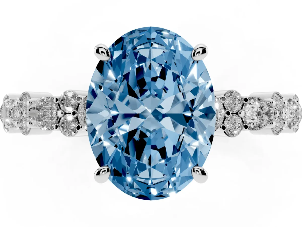 Fancy Blue Oval Cut Diamond Side Stone Solitaire Ring with Round and Four-Prong Setting Silver