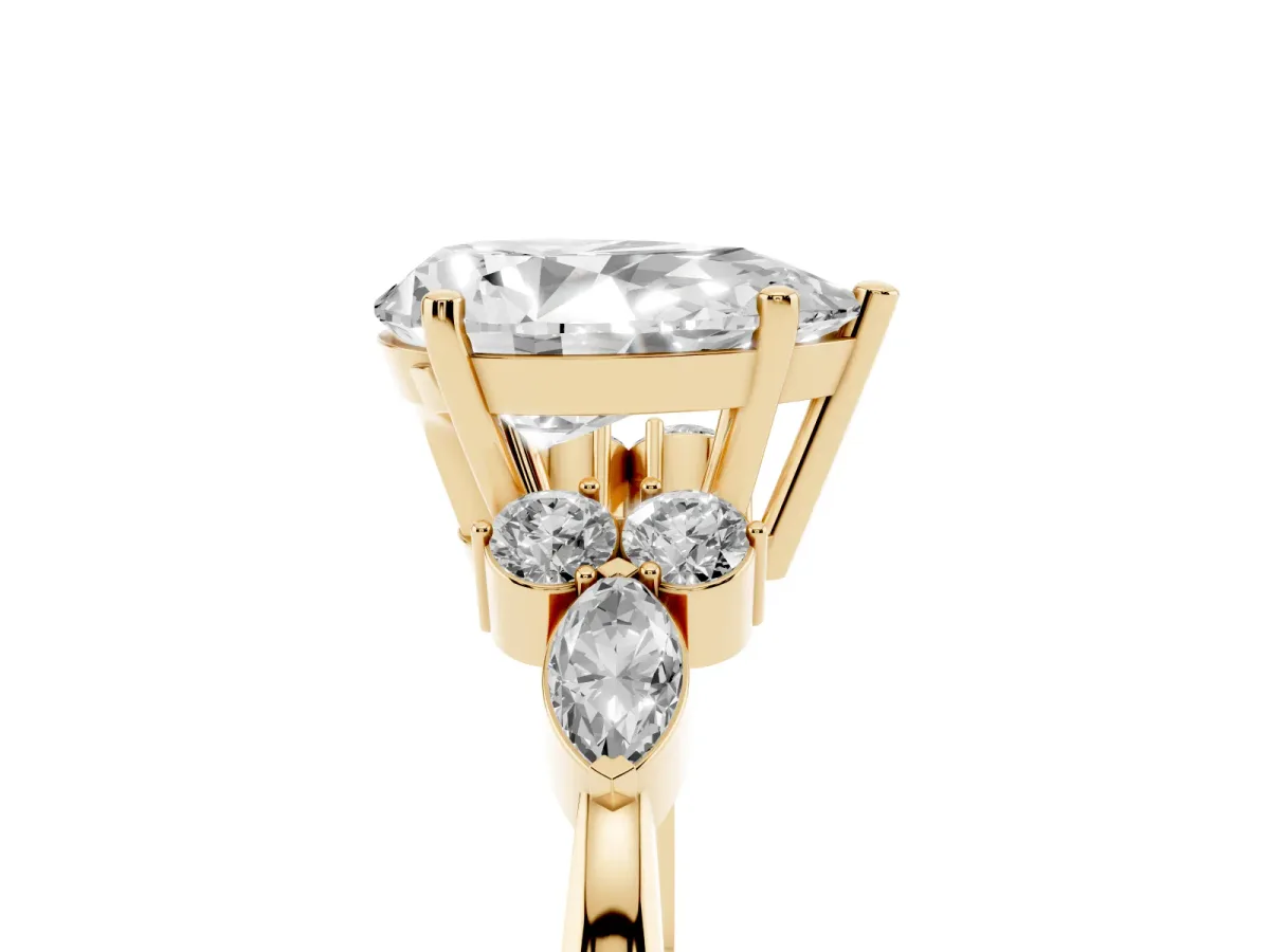Pear Cut Brilliant Diamond Solitaire Ring with Pear Side Stones and Four-Prong Setting Yellow gold