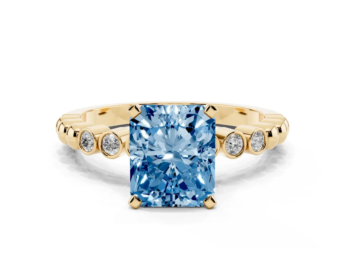 Fancy Blue Radiant Cut Solitaire Bezel Accent Diamond Engagement Ring with Beaded Band and Four-Prong Setting Yellow gold