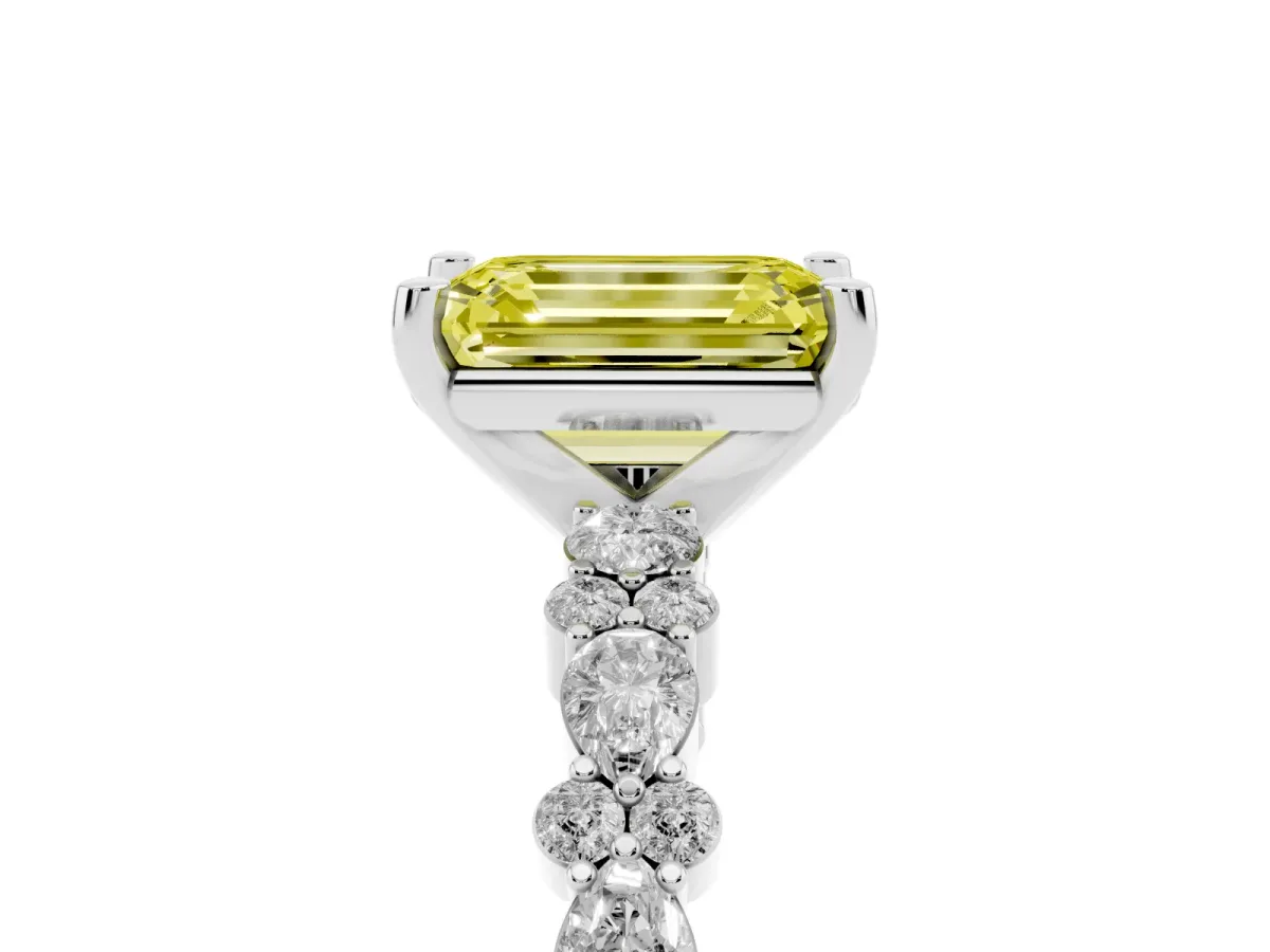 Fancy Yellow Emerald Cut Diamond Side Stone Solitaire Ring with Round and Four-Prong Setting Platinum