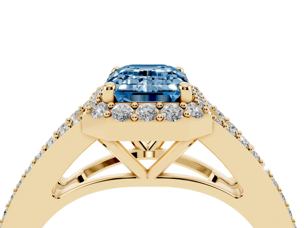 Fancy Blue Emerald Cut Halo Split Shank Pave Diamond Ring with Four-Prong Setting Yellow gold