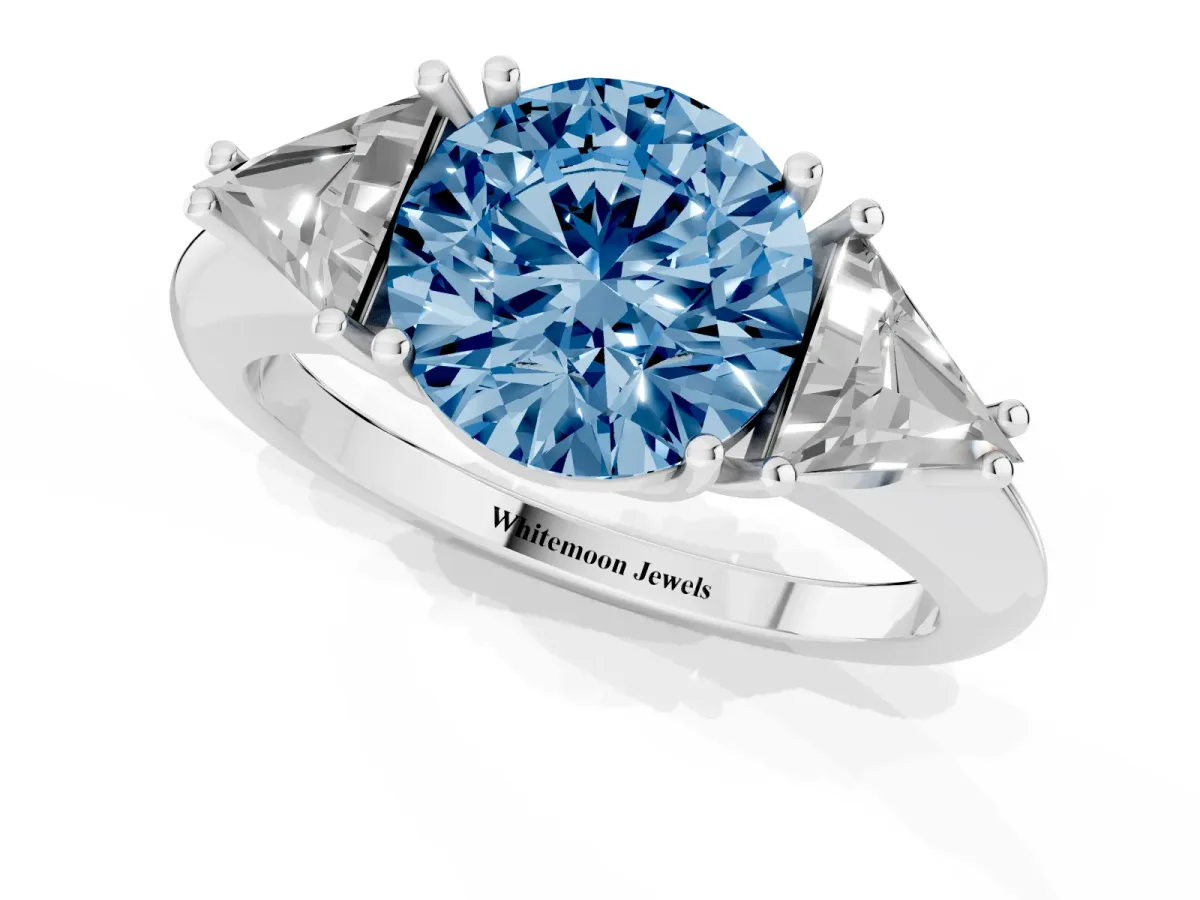 Fancy Blue Three-Stone Round Cut Diamond Engagement Ring with Trillion Side Stones and Prong Setting Silver