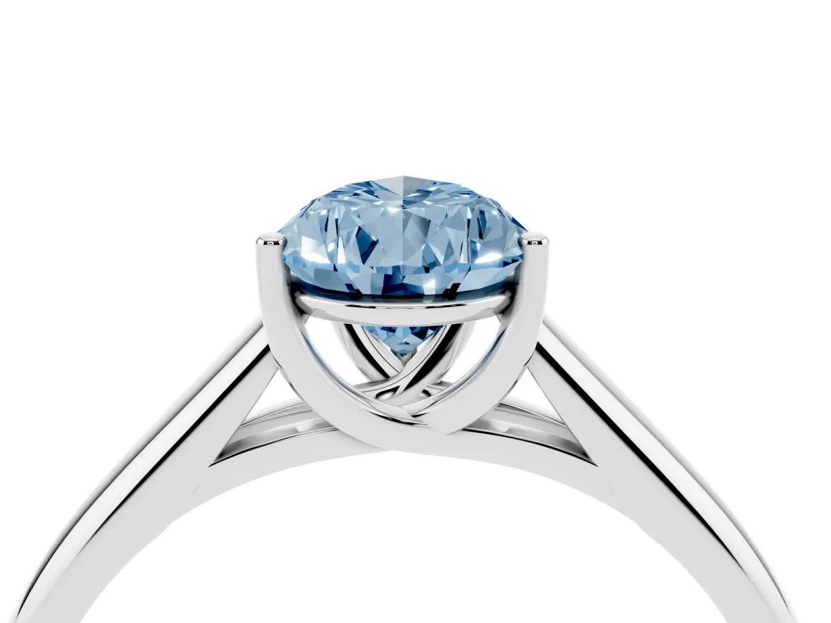 Fancy Blue Pear Cut Solitaire Engagement Ring with Tapered Band and Four-Prong Setting Platinum