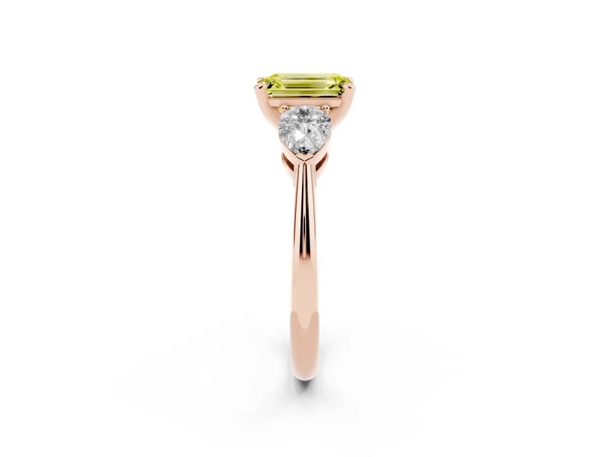 Fancy Yellow Three-Stone Emerald Cut Diamond Ring with Pear Side Stones and Four-Prong Setting Rose gold