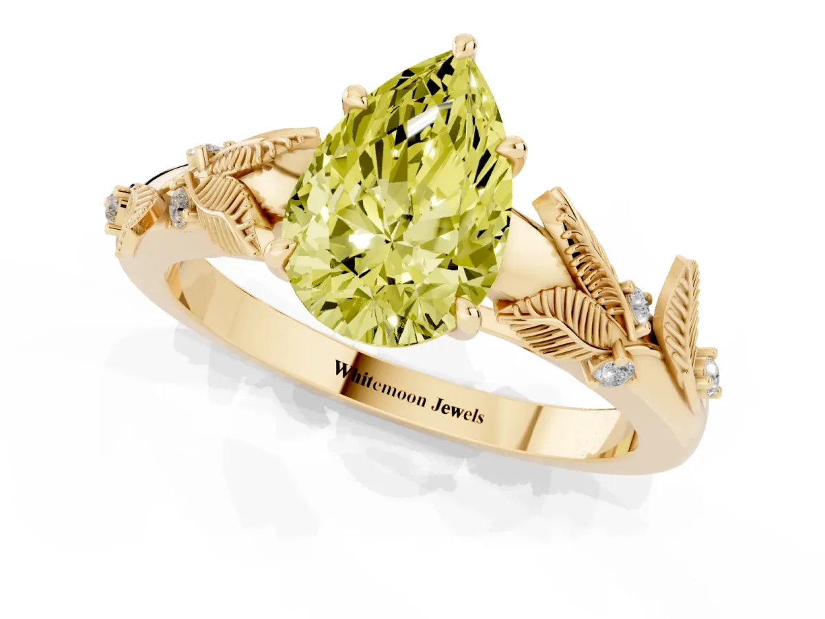 Fancy Yellow Pear Cut Diamond Solitaire Ring with Leaf Motif Band and Four-Prong Setting Yellow gold
