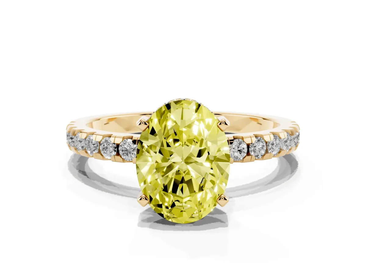 Fancy Yellow Oval Cut Diamond Solitaire Ring with Round Pavé Band and Four-Prong Setting Yellow gold