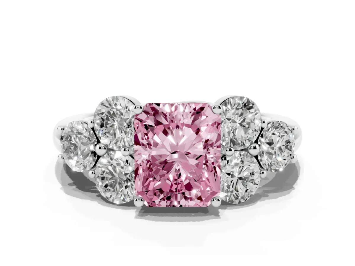 Fancy Pink Radiant Cut Cut Diamond Cluster Ring with Round Accent Stones and Prong Setting on a Classic Band White gold