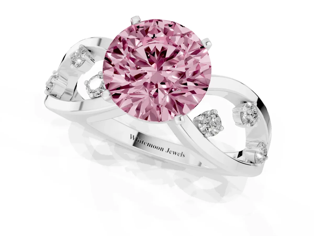 Fancy Pink Round Cut Cut Solitaire Diamond with Side Stones on Criss-Cross Band and Four-Prong Setting White gold