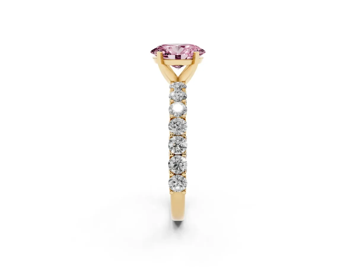 Fancy Pink Oval Cut Diamond Solitaire Ring with Shared Prong Pavé Band and Four-Prong Setting Yellow gold