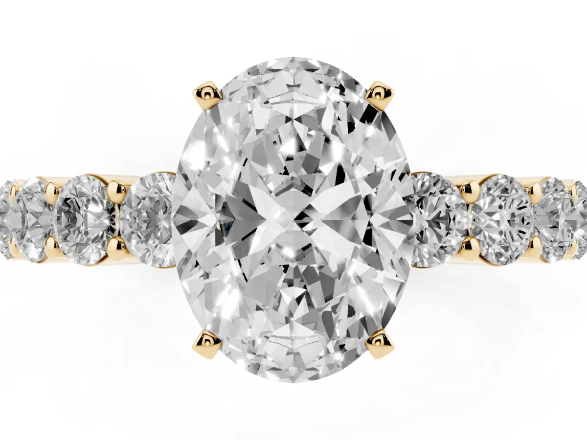 Oval Cut Diamond Solitaire Ring with Shared Prong Round Side Stones Yellow gold