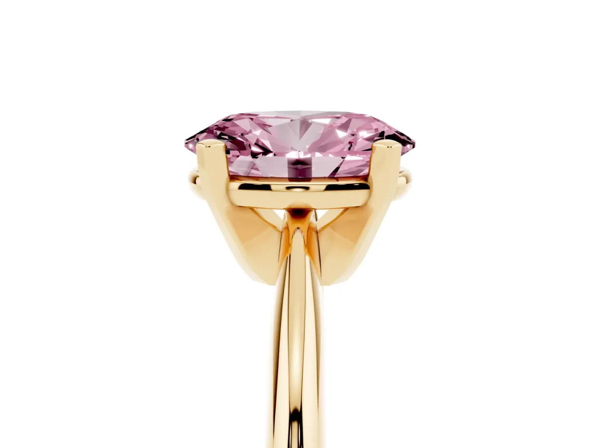 Fancy Pink Oval Cut Cut Solitaire Ring with Four-Prong Setting on a Classic Band Yellow gold