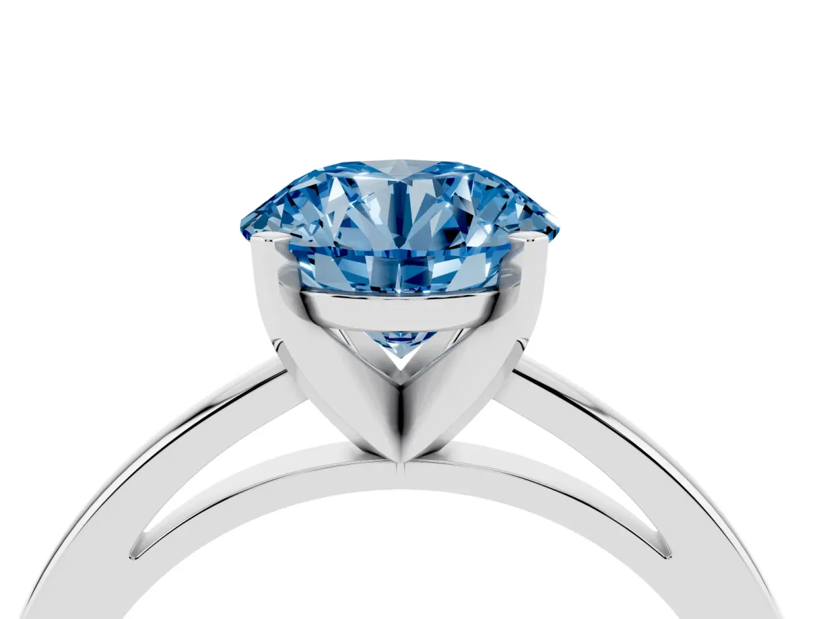 Fancy Blue Round Cut Solitaire Diamond Engagement Ring with Four-Prong Setting on a Classic Band Silver