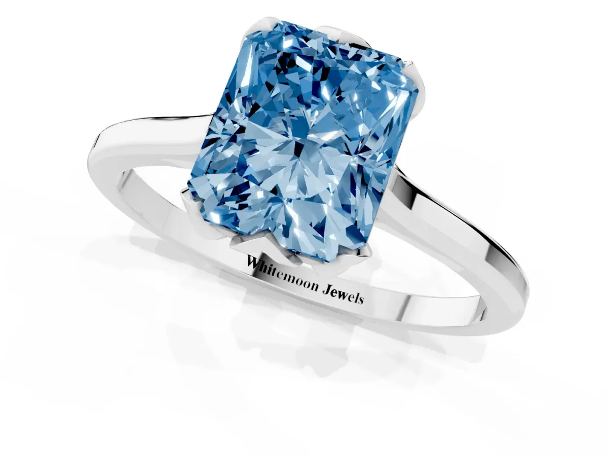 Fancy Blue Radiant Cut Diamond Solitaire Ring with Flower Prong Setting and Classic Band Silver