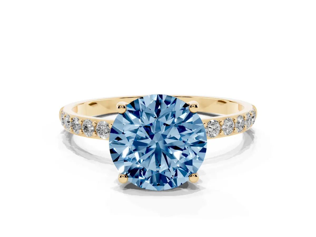 Fancy Blue Round Cut Diamond Solitaire Ring with Round Pavé Shoulders and Prong Setting Yellow gold