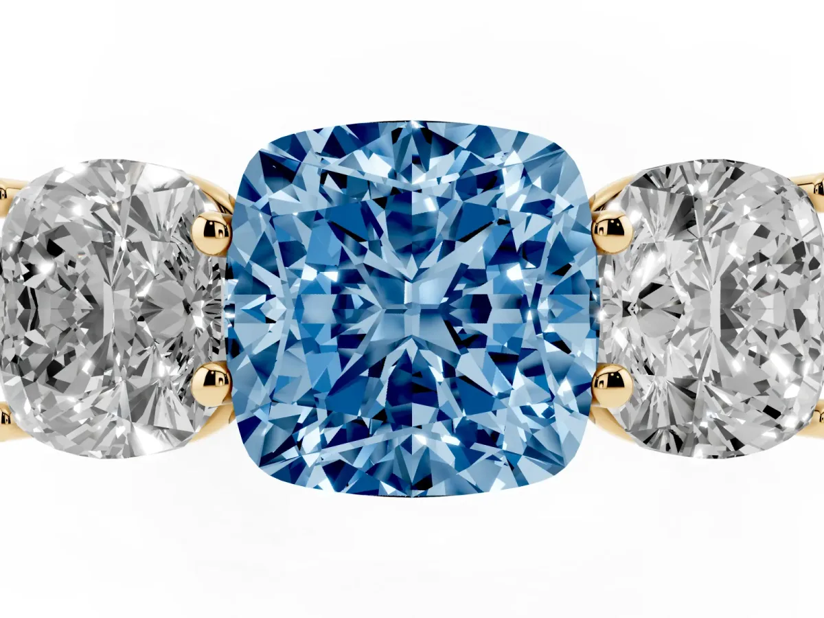 Fancy Blue Cushion Cut Three-Stone Diamond Ring with Prong Setting on a Classic Band Yellow gold