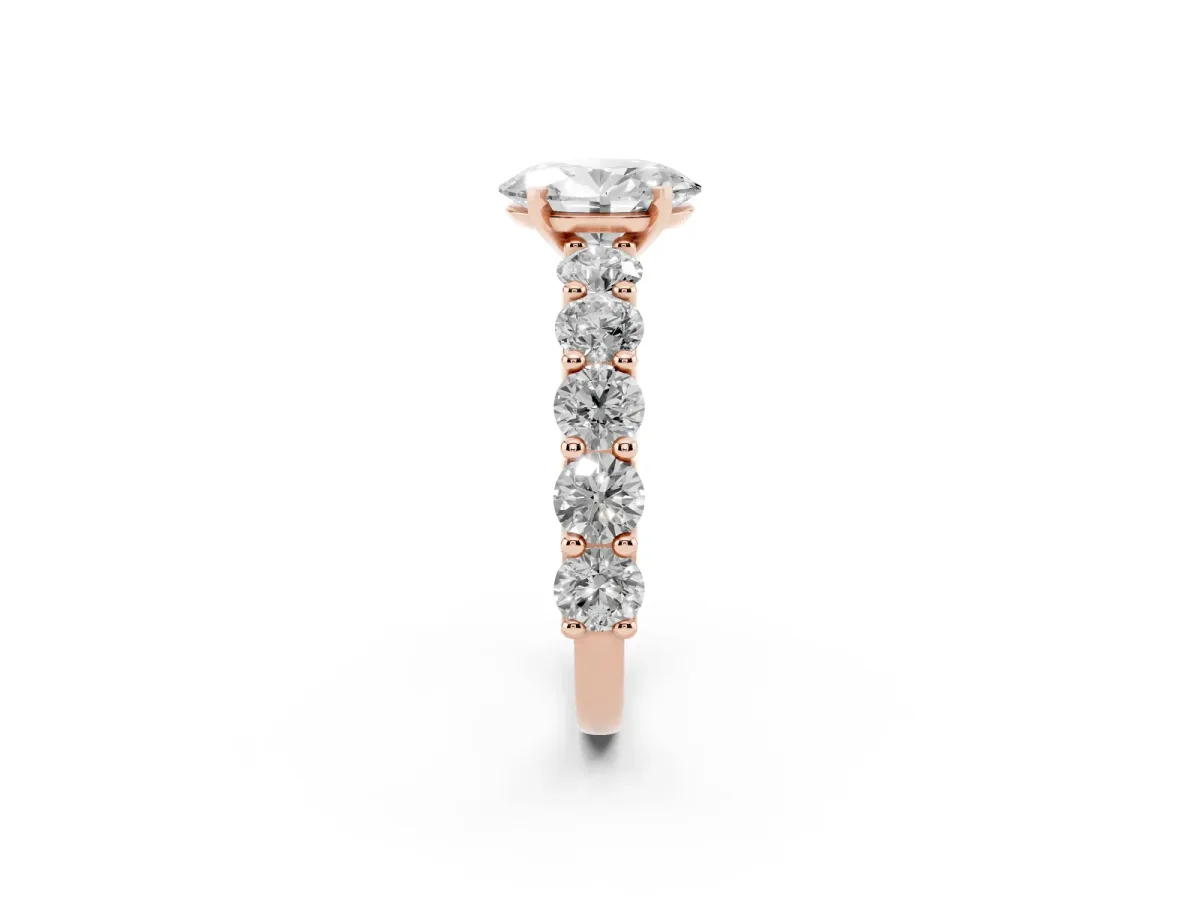 Oval Cut Diamond Prong Setting with Side Stones on a Pave Band Rose gold