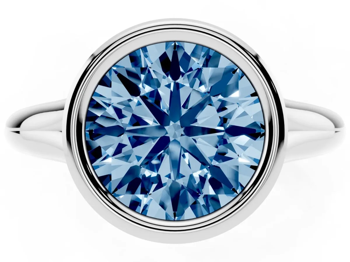 Fancy Blue Bezel Set Round Cut Solitaire Diamond Ring with Smooth Band Silver