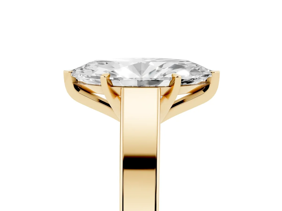 Marquise Cut Solitaire Engagement Ring with Four-Prong Setting and Tapered Band Yellow gold