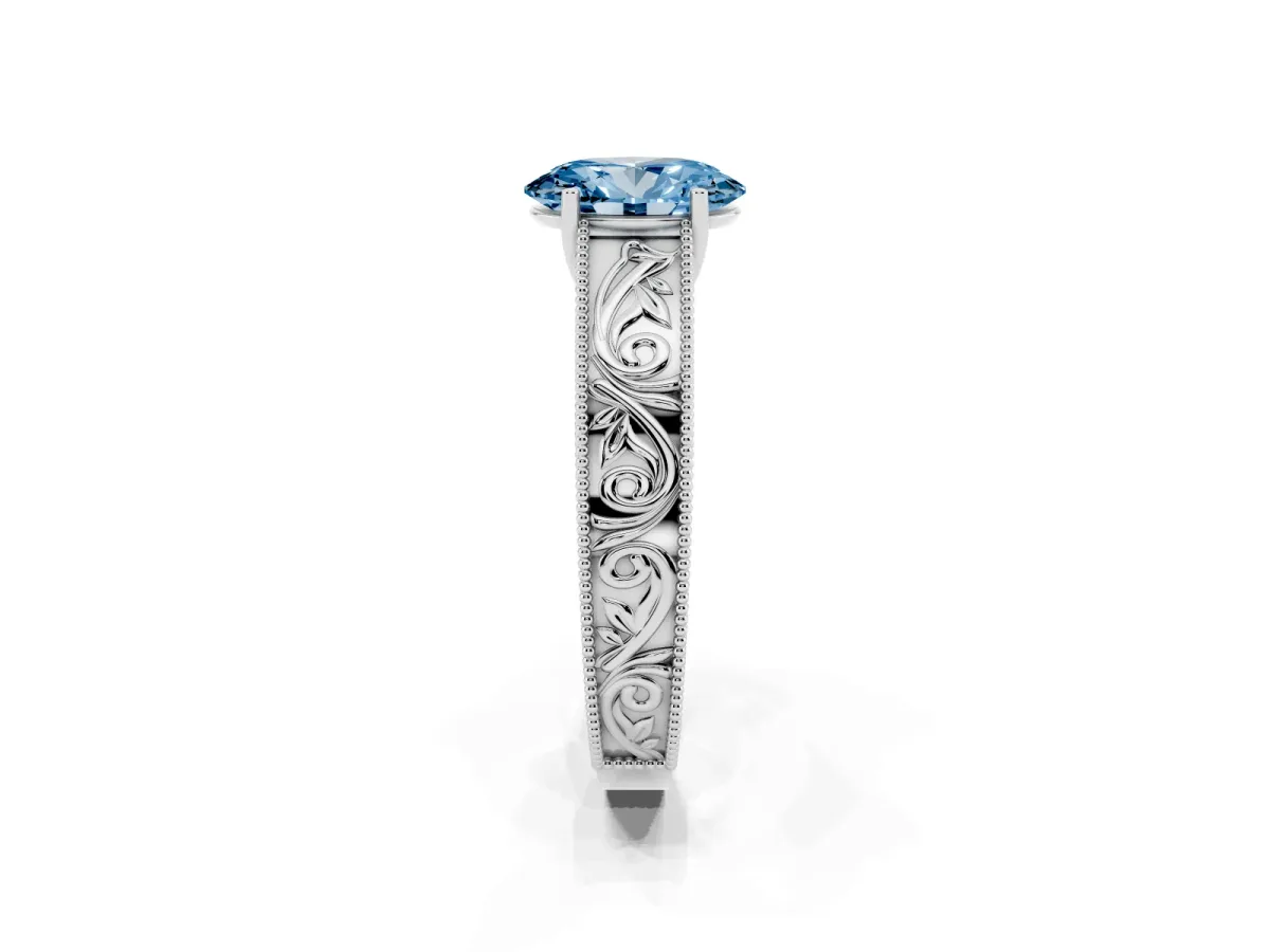 Fancy Blue Oval Cut Diamond Solitaire Ring with Engraved Band and Four-Prong Setting Silver