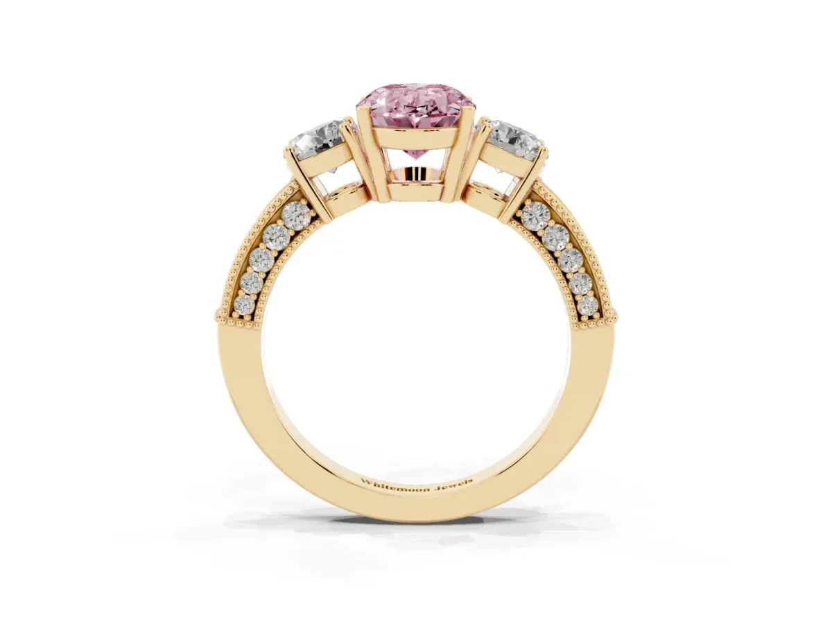 Fancy Pink Oval Cut Three-Stone Diamond Ring with Pavé Band and Four-Prong Setting Yellow gold