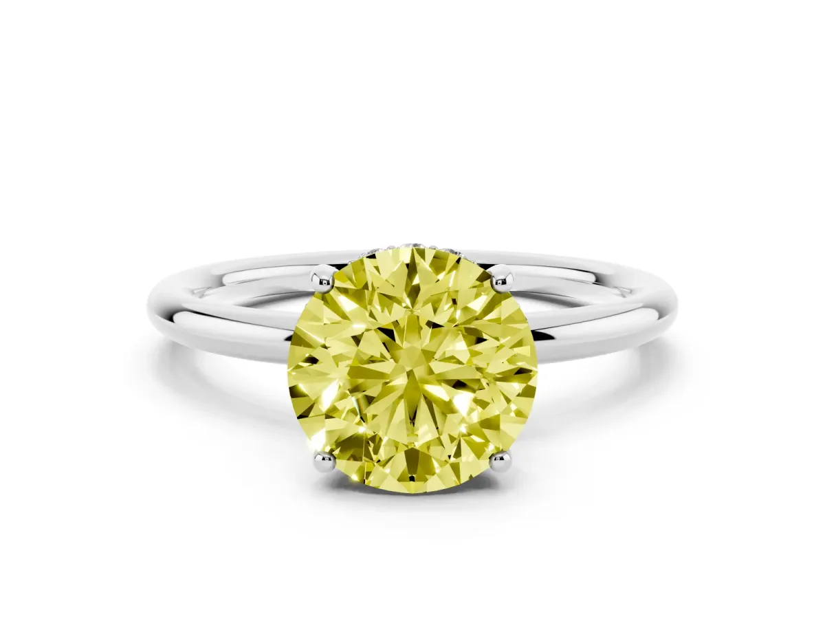 Fancy Yellow Round Cut Solitaire Diamond Ring with a Classic Band and Four-Prong Setting Silver