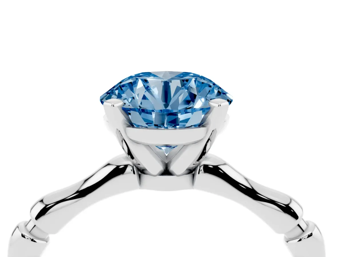 Fancy Blue Round Cut Solitaire Diamond Ring with Bamboo Band and Four-Prong Setting Silver