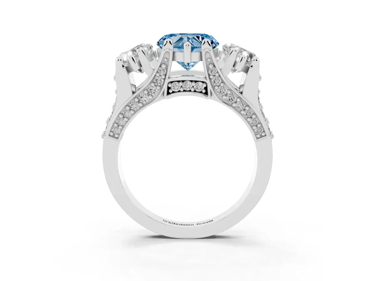 Fancy Blue Heart Cut Diamond Three-Stone Ring with Channel Set Band and Four-Prong Setting Silver