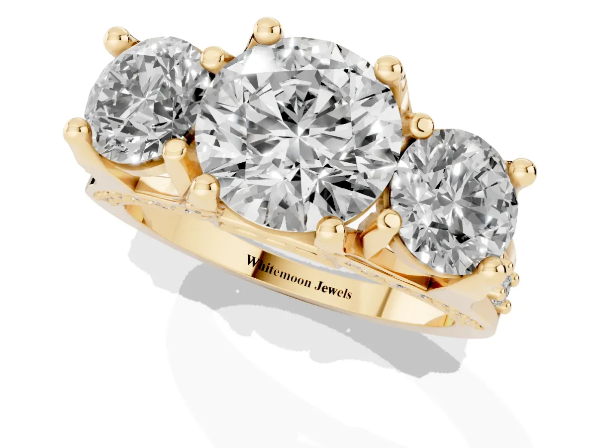 Round Cut Diamond Three-Stone Ring with Channel Set Band and Four-Prong Setting Yellow gold