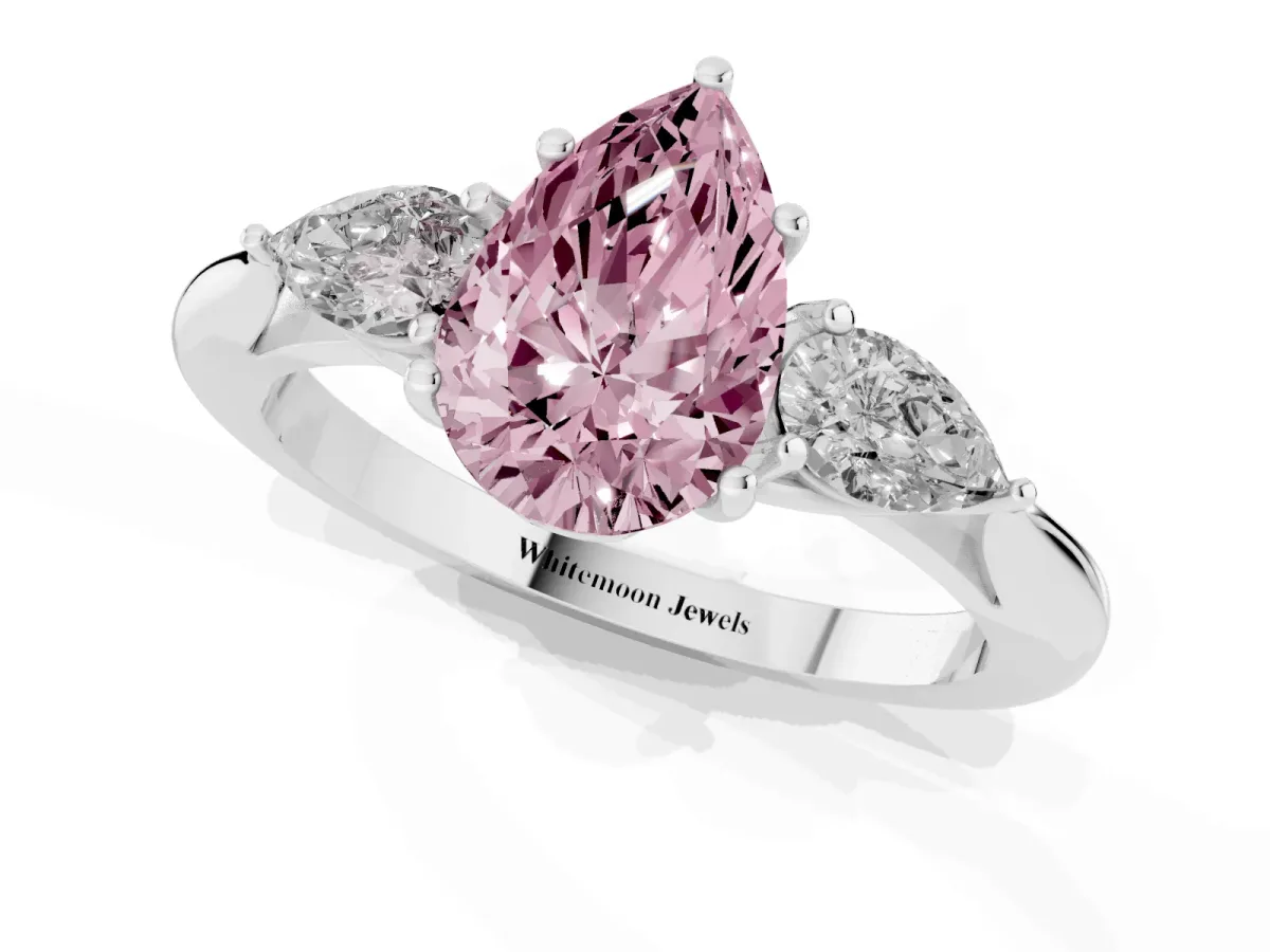 Fancy Pink Three-Stone Pear Cut Brilliant Diamond Solitaire Ring with Tapered Band and Four-Prong Setting White gold
