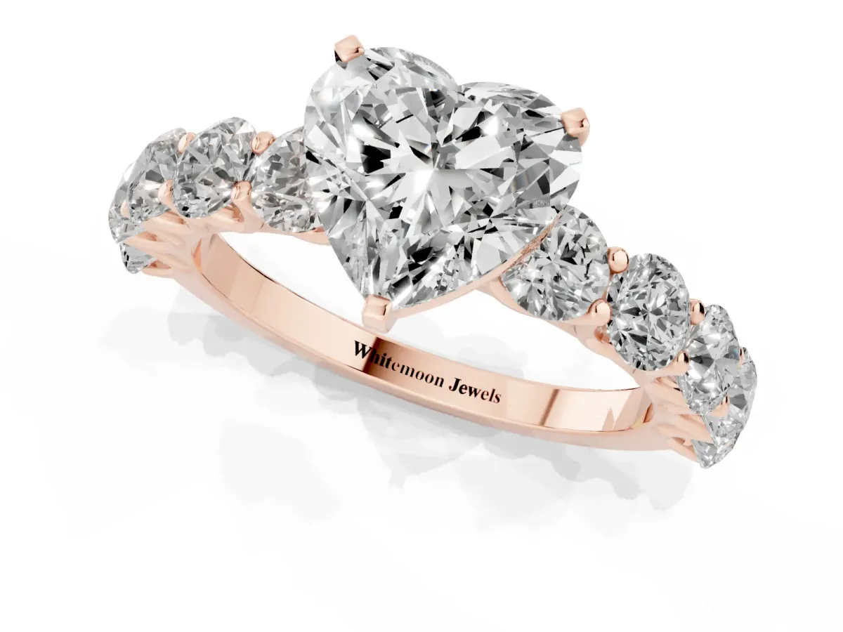 Heart Cut Diamond Prong Setting with Side Stones on a Pave Band Rose gold