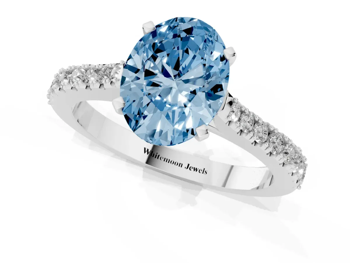 Fancy Blue Oval Cut Cut Solitaire Diamond Engagement Ring with Pave Band and Four-Prong Setting Platinum