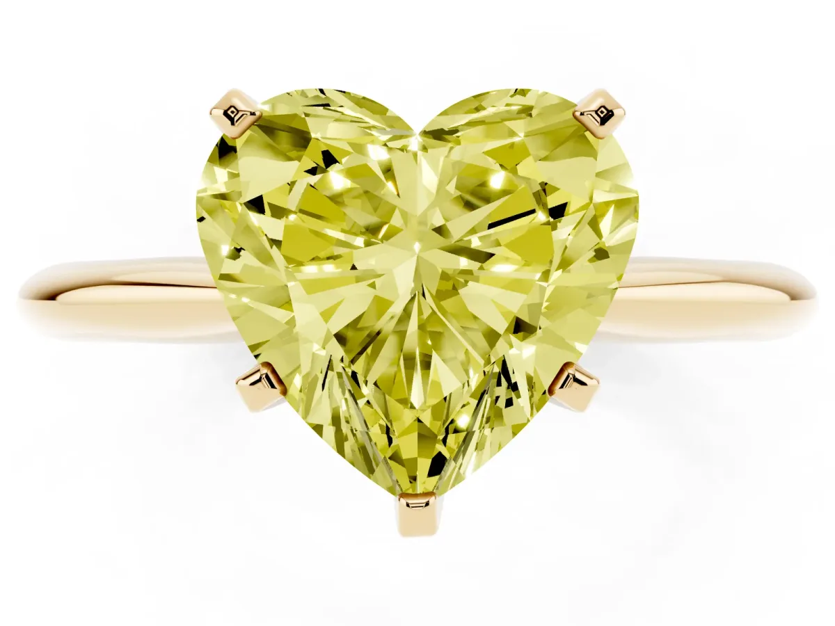 Fancy Yellow Heart Cut Cut Solitaire Ring with Four-Prong Setting on a Classic Band Yellow gold