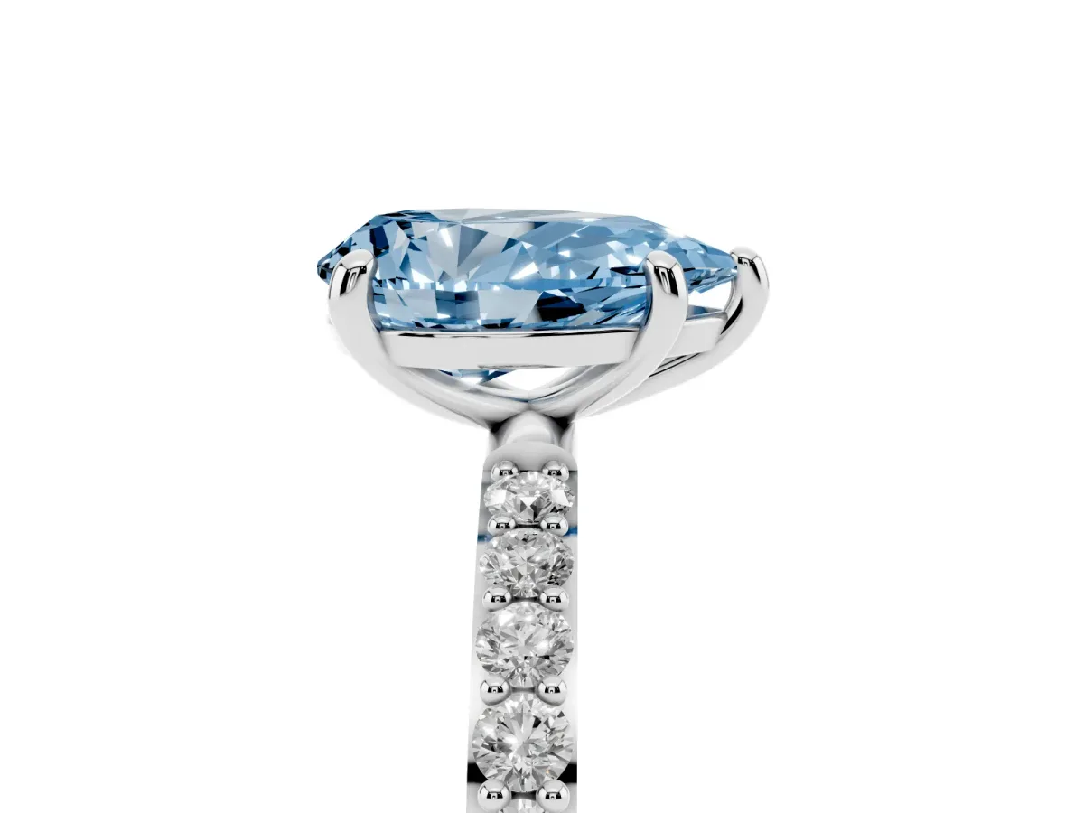 Fancy Blue Pear Cut Diamond Solitaire Ring with Round Pavé Band and Prong Setting Platinum