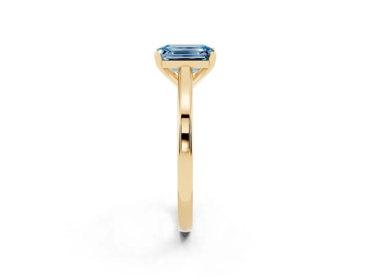 Fancy Blue Emerald Cut Solitaire Diamond Ring with Four-Prong Setting and Classic Band Yellow gold