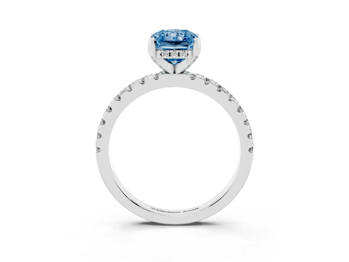 Fancy Blue Radiant Cut Diamond Solitaire Ring with Round Pavé Band and Four-Prong Setting Silver