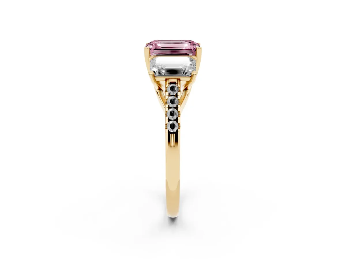 Fancy Pink Three-Stone Emerald Cut Diamond Ring with Round Pavé Band and Prong Setting Yellow gold