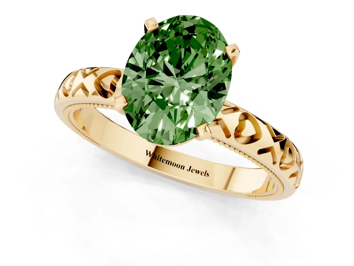 Fancy Green Oval Cut Solitaire Diamond Engagement Ring with XO Engraved Band and Four-Prong Setting Yellow gold
