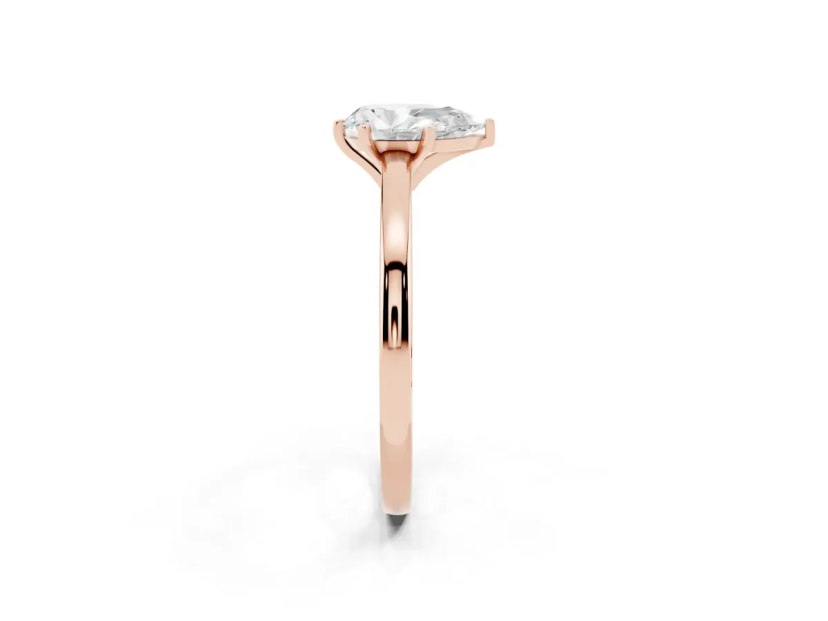 Pear Cut Solitaire Diamond Engagement Ring with Four-Prong Setting on a Classic Band Rose gold