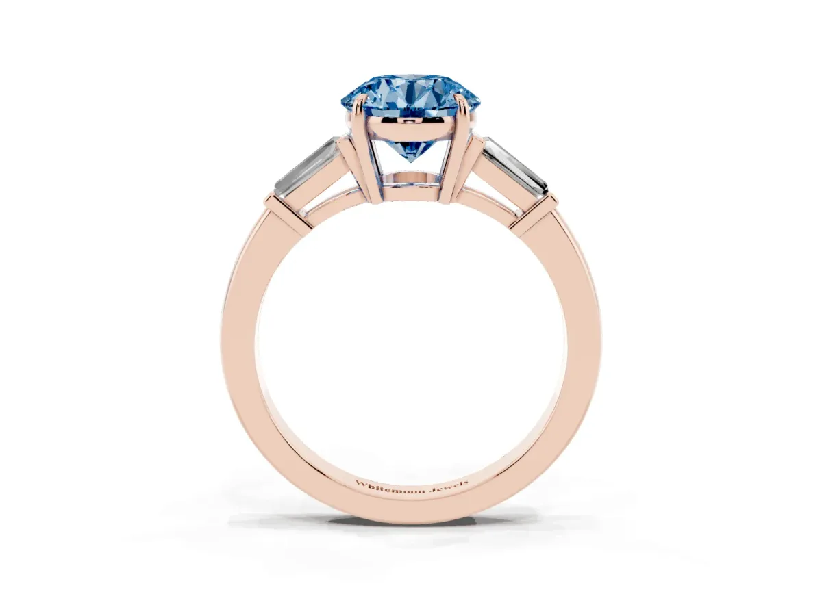 Fancy Blue Round Cut Diamond Three-Stone Ring with Tapered Baguette Side Stones and Prong Setting Rose gold
