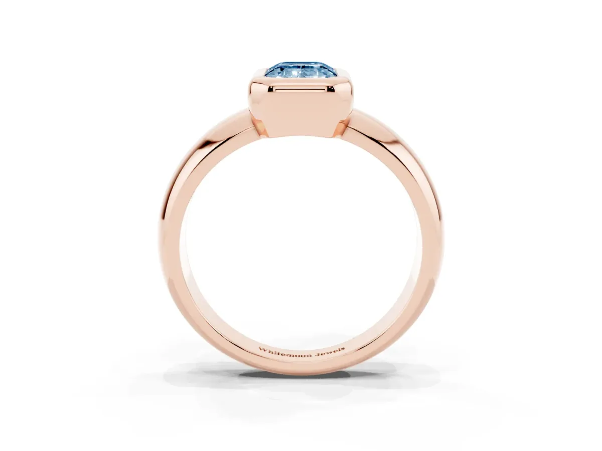 Fancy Blue Bezel Set Emerald Cut Solitaire Ring with Wide Band Rose gold