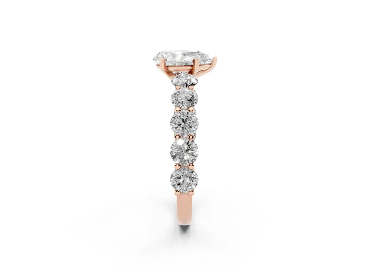 Pear Cut Diamond Prong Setting with Side Stones on a Pave Band Rose gold