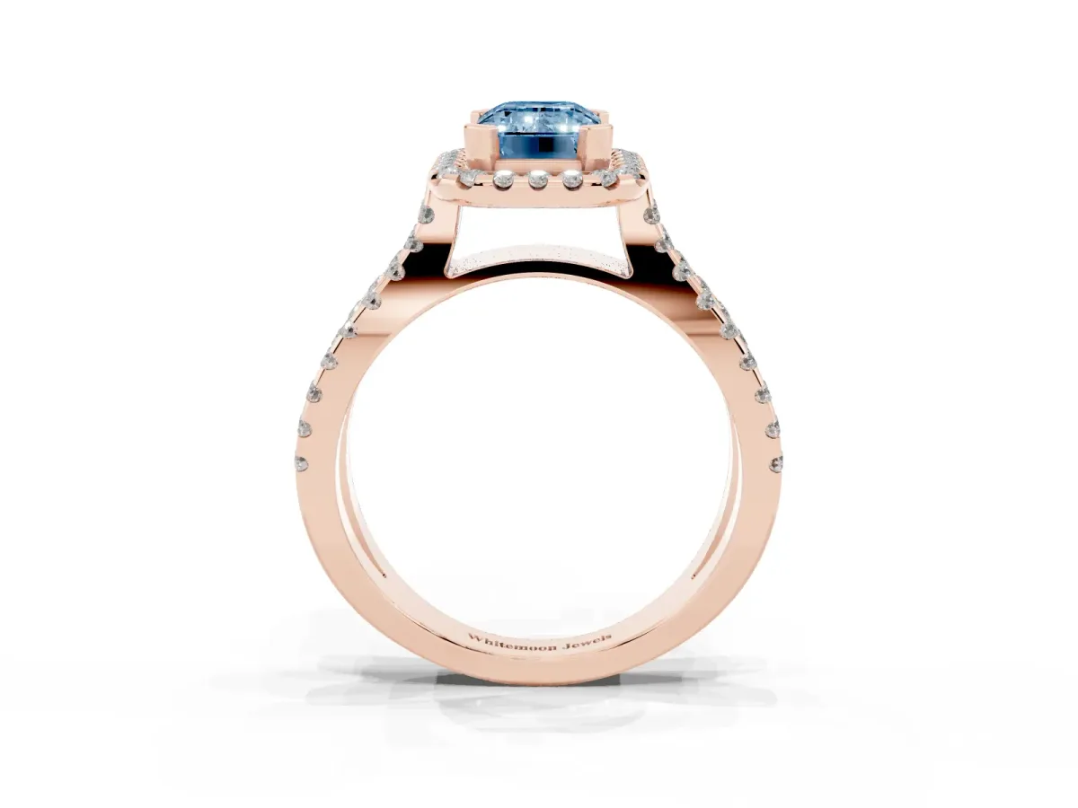 Fancy Blue Emerald Cut Diamond Halo Ring with Split Shank Pavé Band and Prong Setting Rose gold