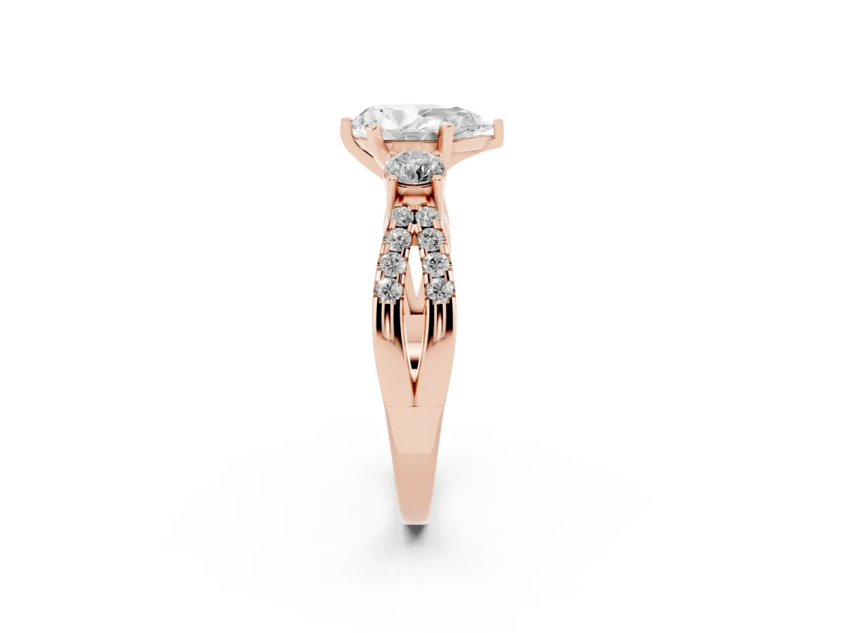 Pear Cut Diamond Three-Stone Ring with Pavé Split Shank and Four-Prong Setting Rose gold