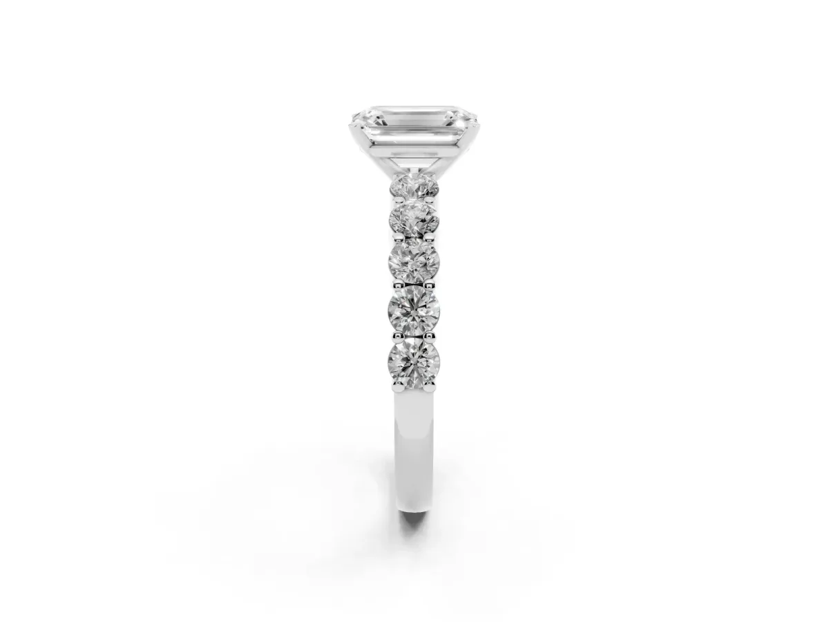Emerald Cut Diamond Solitaire Ring with Shared Prong Round Side Stones Platinum
