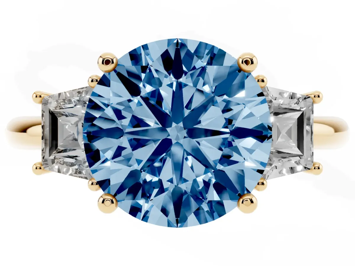 Fancy Blue Round Cut Diamond Three-Stone Ring with Trapezoid Side Stones and Prong Setting Yellow gold